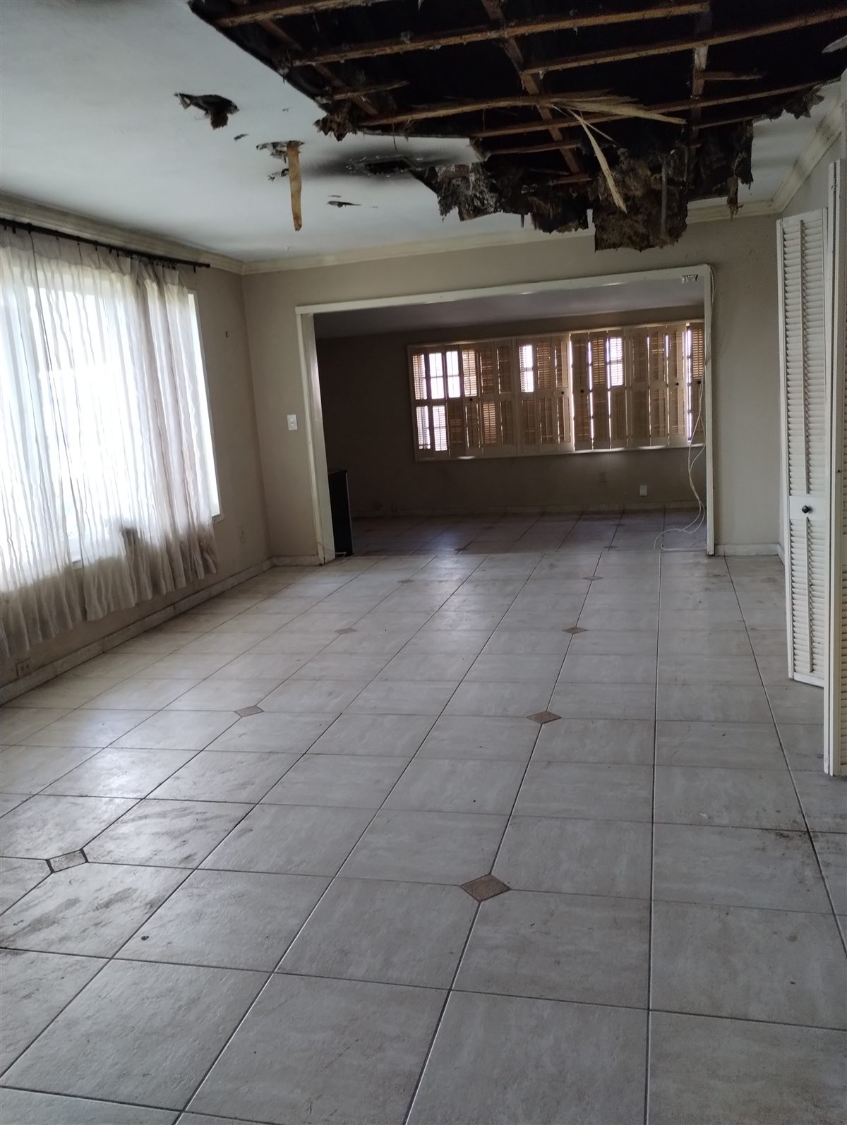 Interior of a home we bought with severe ceiling damage